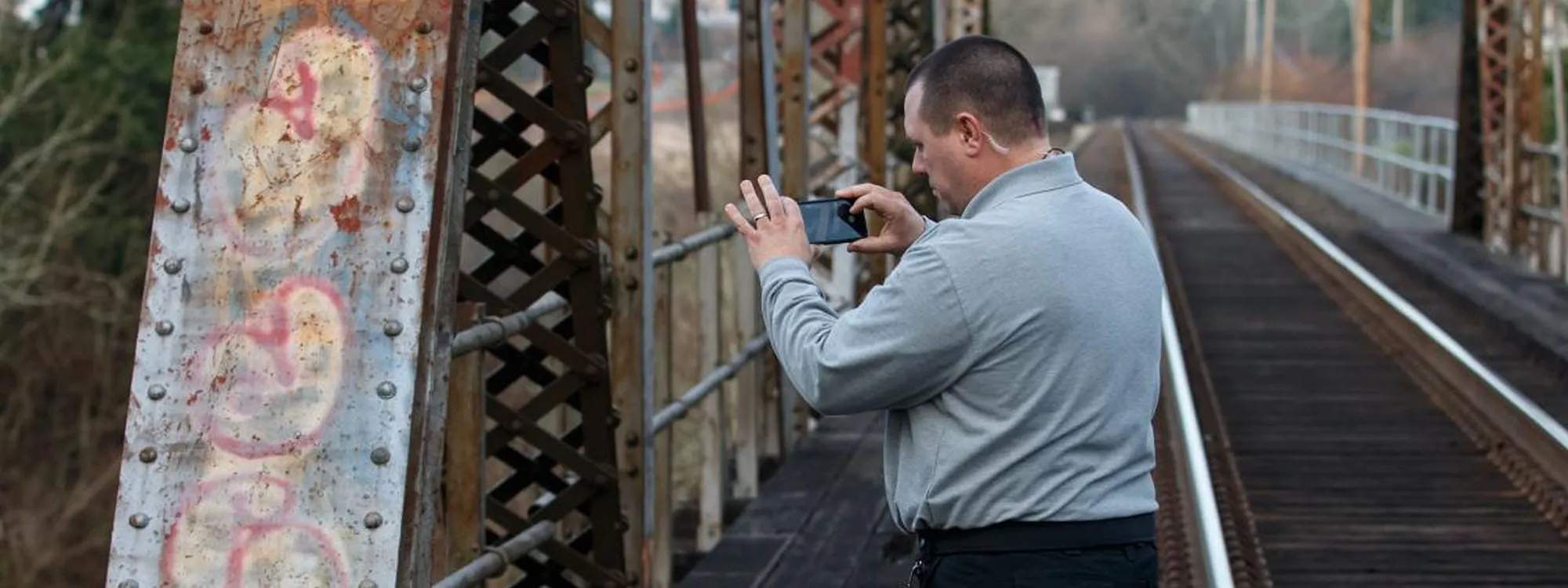 Officer taking a photo of graffiti