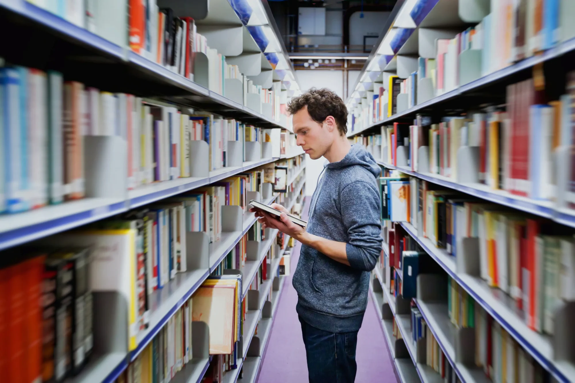 Man browsing library shelves