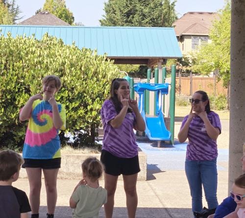 Cute teen volunteers at storytime