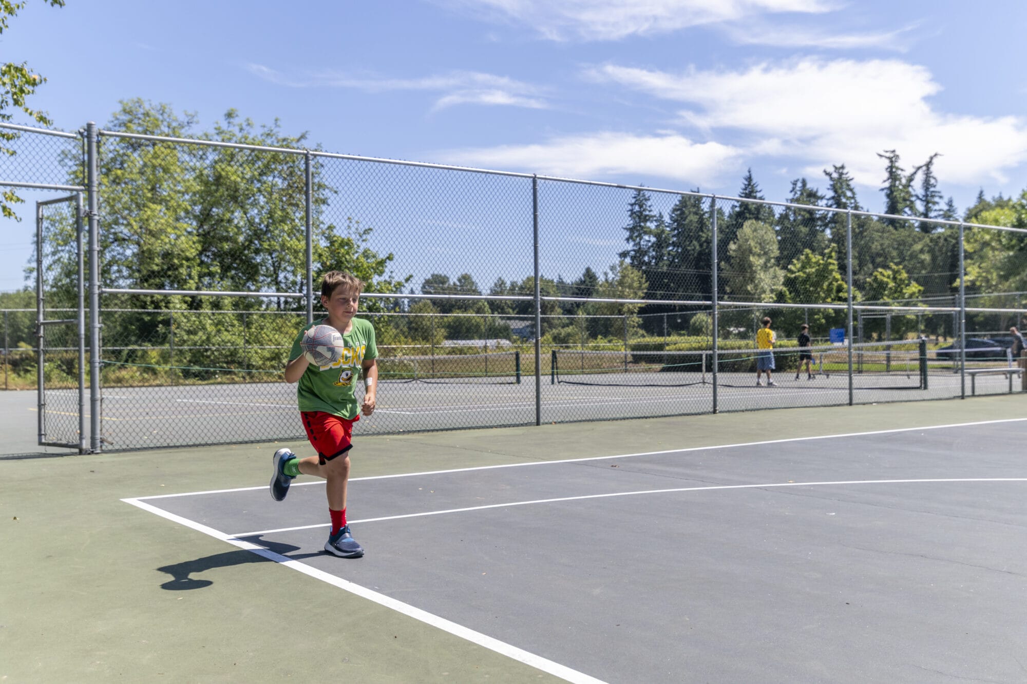 City of Tualatin Jurgens Park child playing basketball